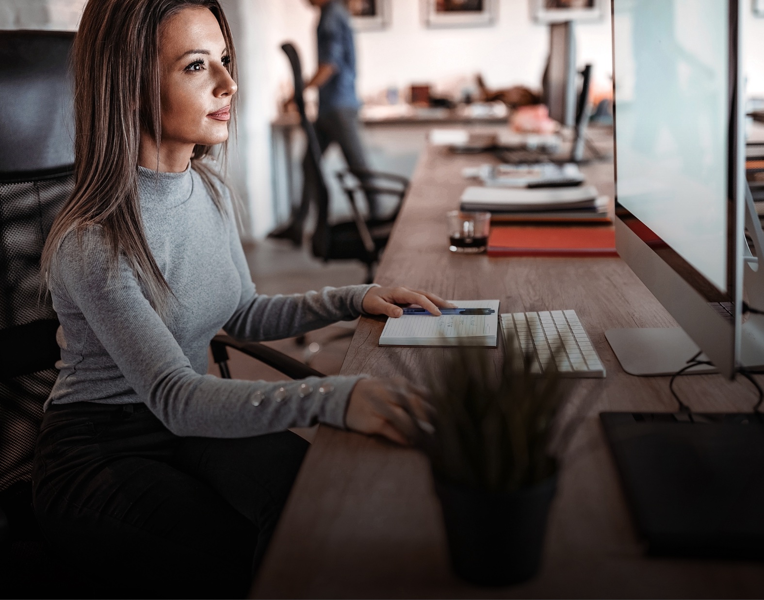 Compliance professional reviewing documents